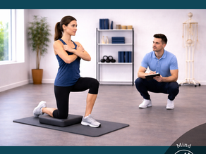 A person performs a controlled movement while a practitioner observes posture and coordination. The scene illustrates how movement patterns are evaluated based on organization, balance, and control rather than effort alone, highlighting the role of the nervous system in guiding movement.