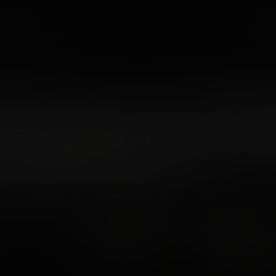 Densely packed hillside houses under a clear sky at sunrise. Lush greenery in the foreground, cityscape extends into the distance. Date: 2023.02.26.