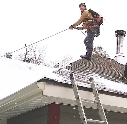Rope and harness used to gain access to the roof and safely preform a chimney sweep on a winter's day.