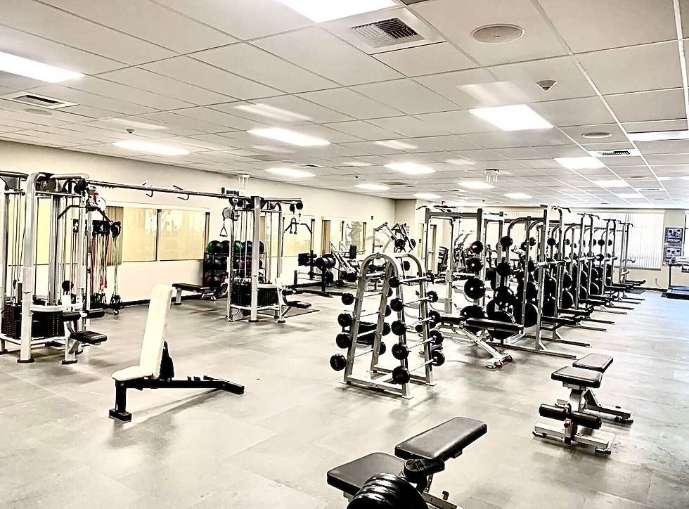 This is a weight lifting room with plenty of elbow room with ample equipment throughout the room.  Some sports such as football and wrestling require weightlifting for successful performances. 