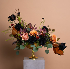 Penelope arrangement — black garden roses with muted peach and orchid tones by White House Flowers.
