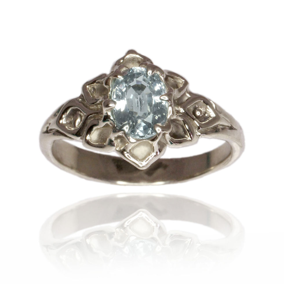 This ring features a 7x5mm stone blooming out of a blossoming lotus. This ring measures 11.5mm wide in the center front and tapers down to a more comfortable 2.2mm around the back.

This setting can accommodate both cabochon or faceted stones.

Catalogue Number RS-5