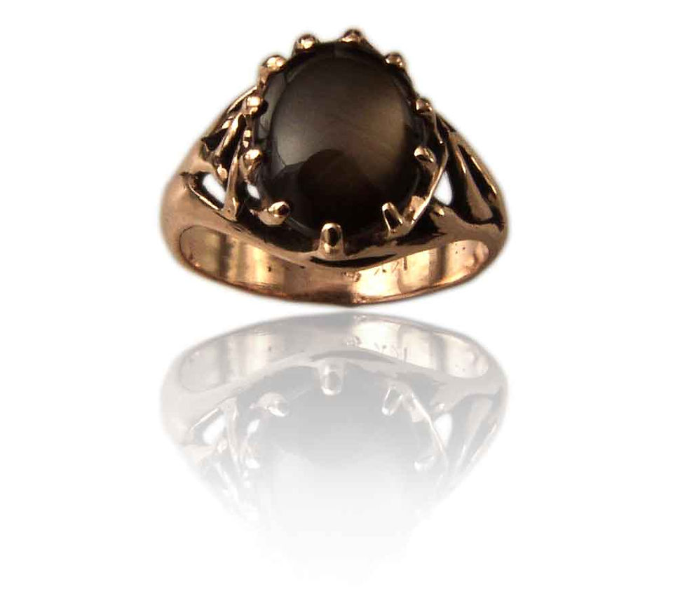 These two Mighty Oaks gently embrace, becoming united at the furthermost reaches of their branches where they merge and become one ring. The ring is open between the branches, creating this ring a delicate design yet strong band. They come together to hold up an oval-shaped 12x10mm stone.
The setting can accommodate a faceted or cabochon stone.
Catalogue Number RS-133