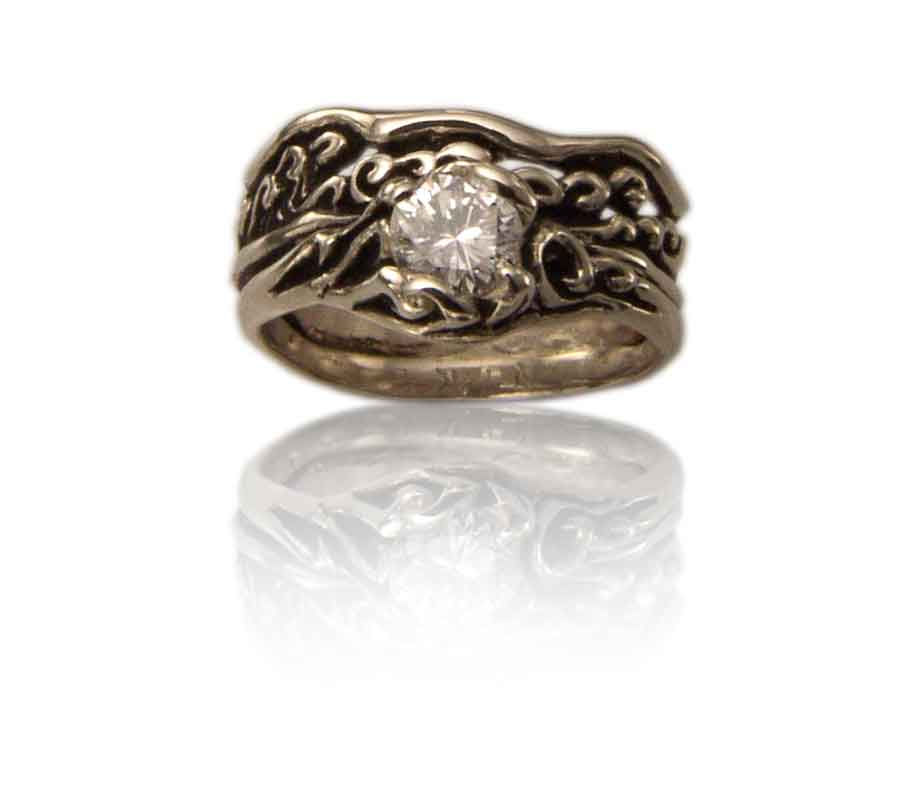 The flowing design of this set features our 5mm waves on stone ring (RS-106) with a solitaire stone that can hold about a 1/2ct diamond. The accompaniment band with a notch (WB-20) perfectly fits this engagement ring. The swirling wave motif is features on both bands. 

For a wider matching band without a stone, check out our Waves Wide Band (WB-17) or the Waves Wide with Sun Band (WB-16)

Catalogue Number WS-1