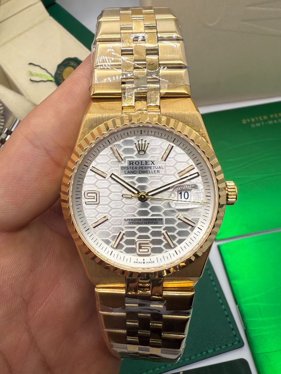 Rolex Oyster Perpetual Land‑Dweller 40mm Dourado, Mostrador Prata