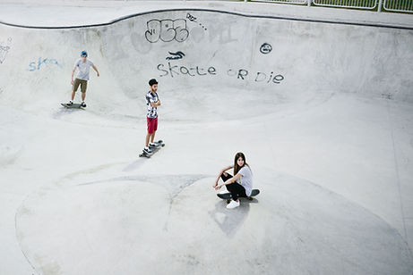 skateboaders in the skate bowl chilling and riding their skateboard