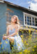 Graduation photo session of young graduate in beautiful sky blue dress