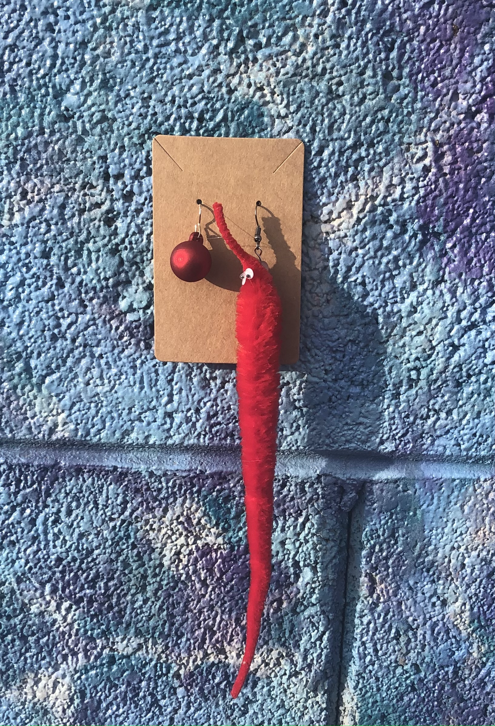 red bobble and worm earrings