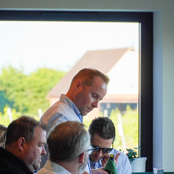 Paul Laurie pouring wine at a tasting