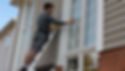 Window cleaning on ladder closeup