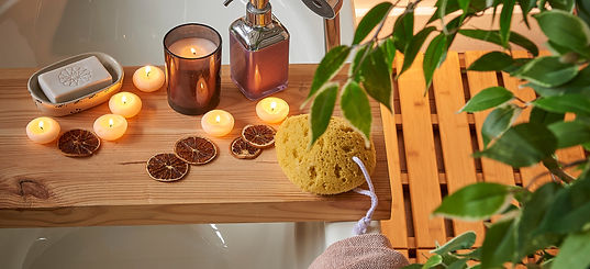 Spa bathtub wooden table vase of plant candle towel brush all kind of spa object. Modern s