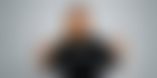 A woman wearing a shirt that says Be Sticky-Outy.