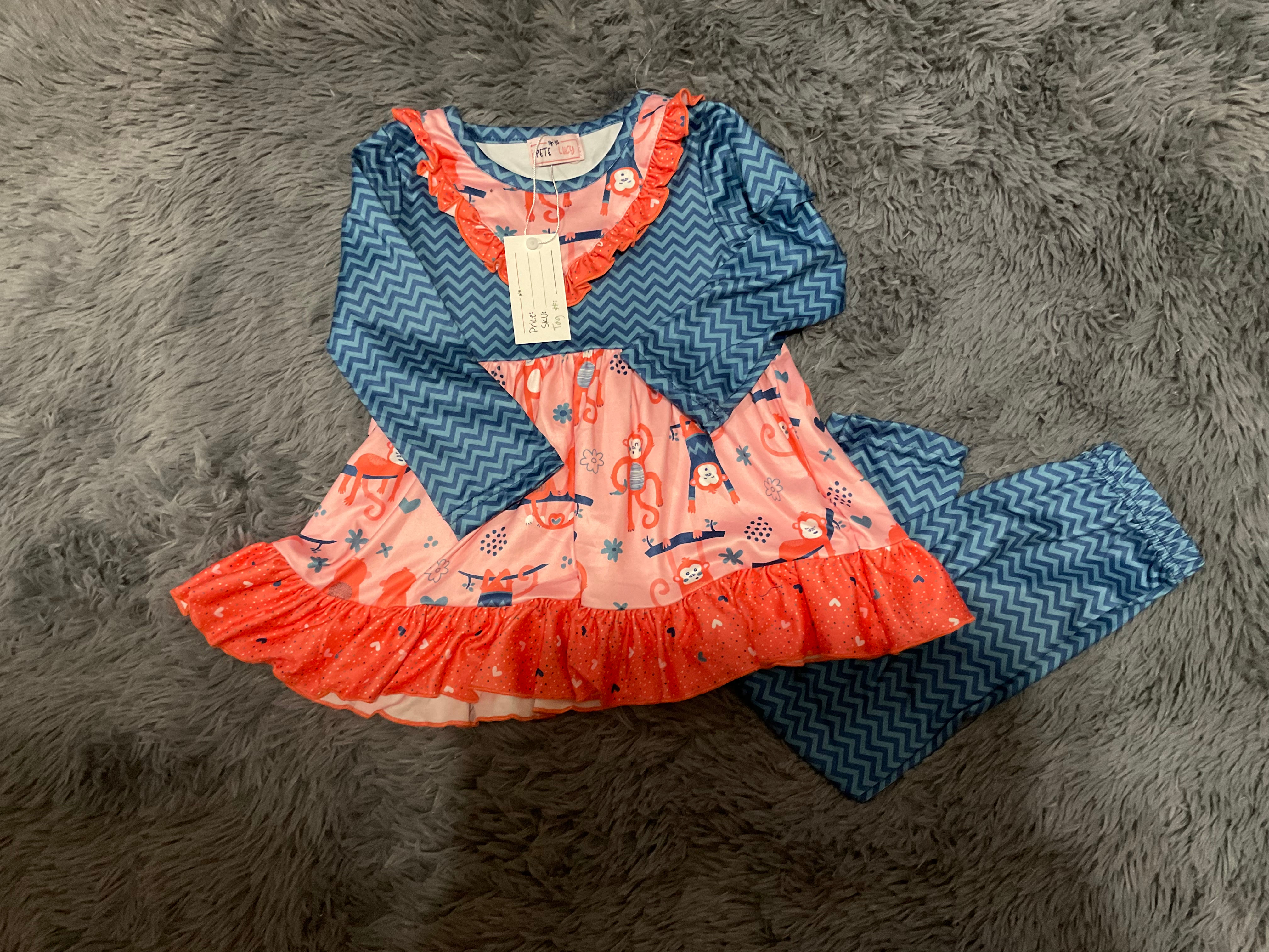 Pinkish orange shirt with monkeys and hearts