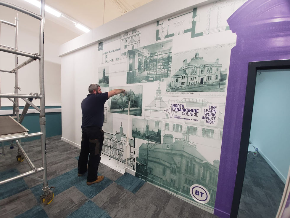 digital-printed-vinyl-being -applied-to-a-wall