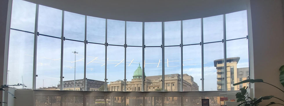 Internal view of solar control window film on the glass front of a commercial building