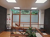 Frost window film for two-way 24 hour privacy installed on a commercial building