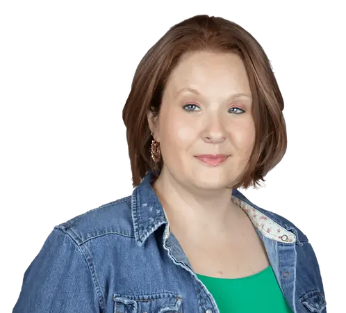 Studio portrait of Suzanne Wynn, Southern voiceover artist and audio producer with a confident, fiery expression.