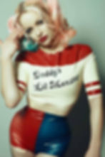 latex harley quinn inspired pin up set with high waisted hot pants and cropped top
