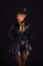 Front view of The Collar Obsidian Cape by Catalyst Latex , cropped black latex cape with collar and popper fastening.