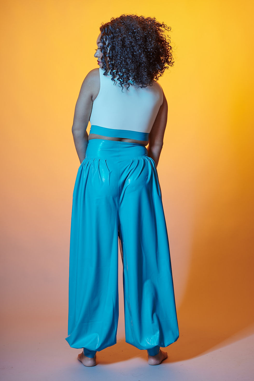 Thumbnail: latex loose flowing yoga pants pull on waistband and lots of latex in each leg