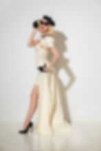 latex long skirt with front split in milky white worn with mini underwire pencil dress and houndstooth peterpan collar bolero