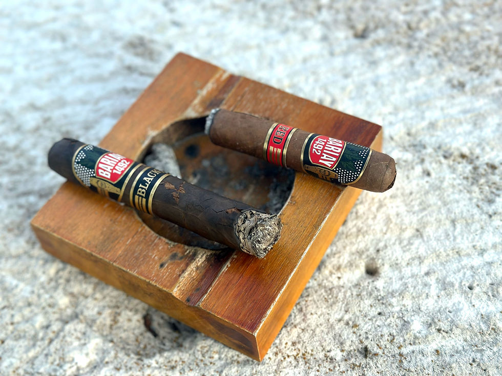 Ashed cigars resting on an ash tray on a marble white table
