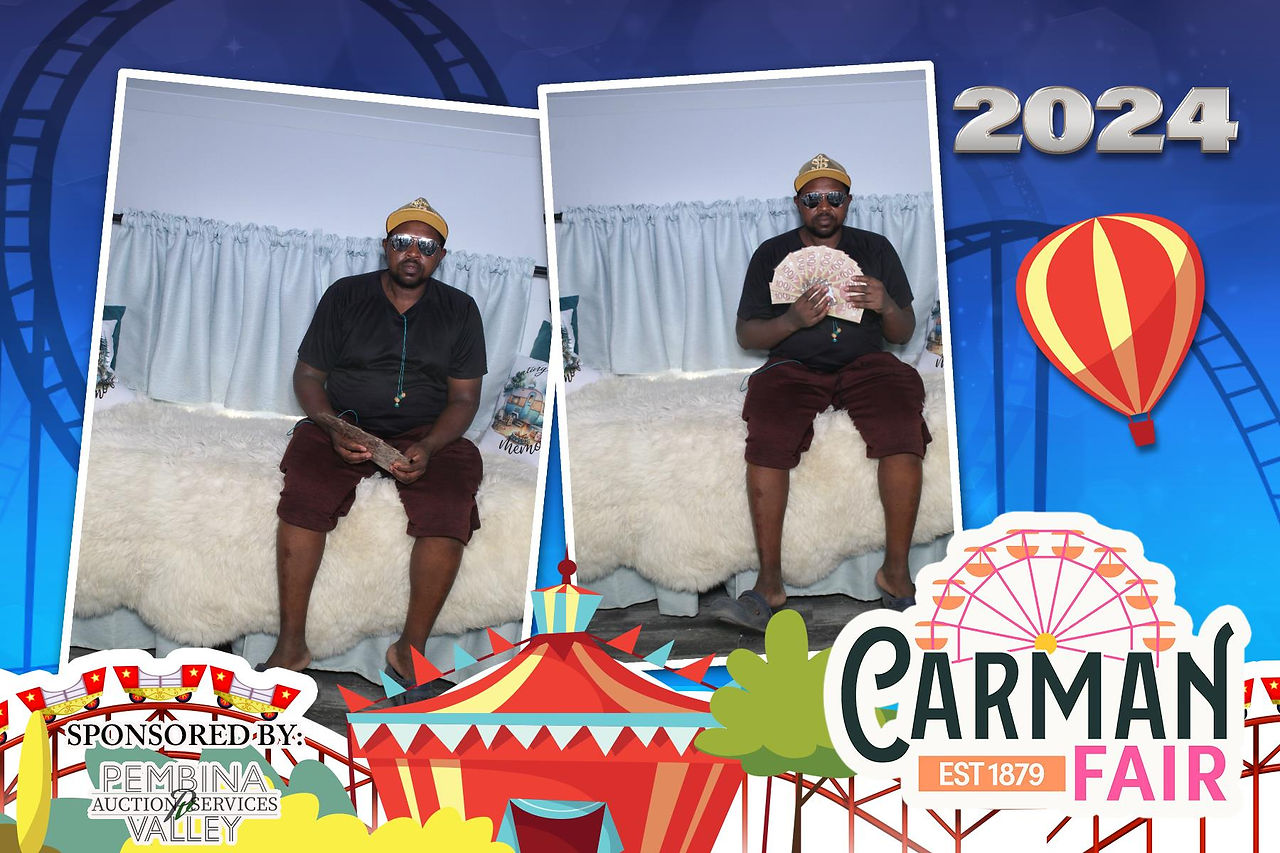 Guests Taking a fun picture with props in A Camper Photo Booth st Carman Country Fair