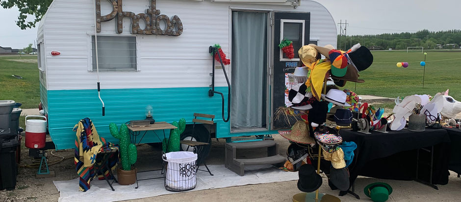Outside view of the Vintage Camper Photo Booth set up for a Fiesta event with colourful décor.
