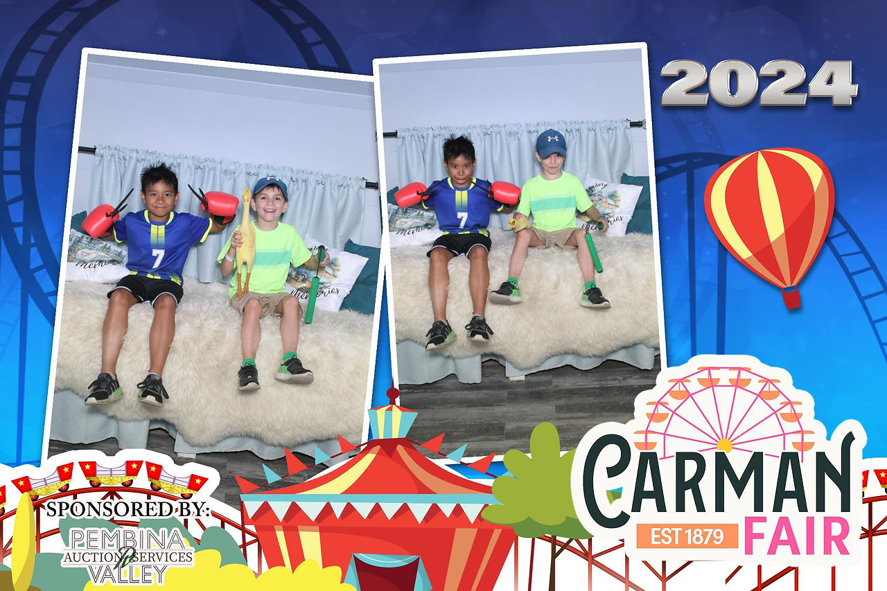 Guests Taking a fun picture with props in A Camper Photo Booth st Carman Country Fair