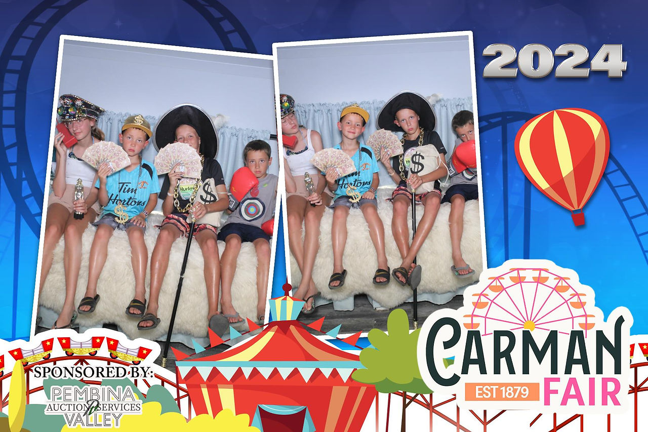 Guests Taking a fun picture with props in A Camper Photo Booth st Carman Country Fair