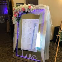 Wedding seating chart displayed on Mirror Me Booth