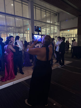 Roaming photo booth capturing candid guest photos during a social event in Winnipeg.