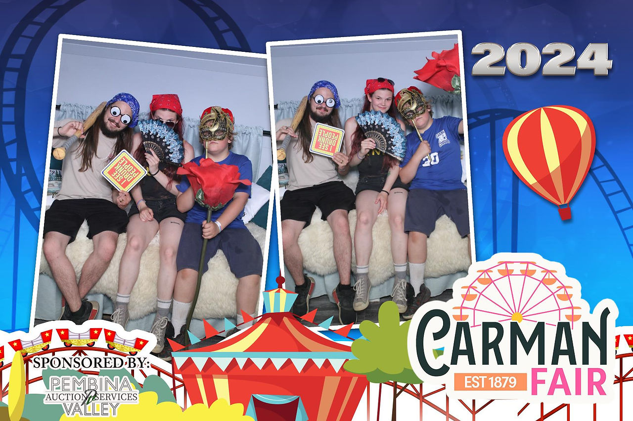 Guests Taking a fun picture with props in A Camper Photo Booth st Carman Country Fair