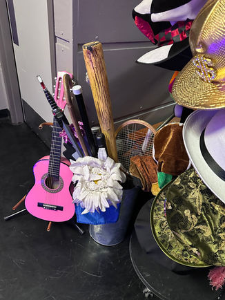 1980s themed photo booth props arranged for retro event setup