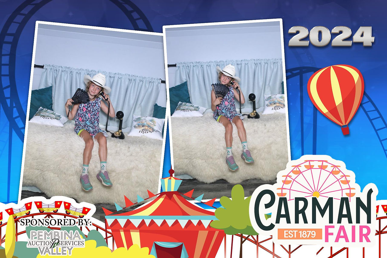 Guests Taking a fun picture with props in A Camper Photo Booth st Carman Country Fair