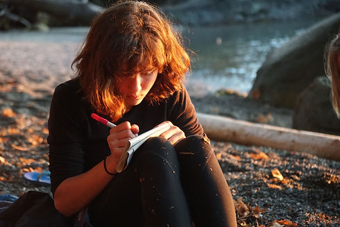 Keona Writing on Beach.jpeg