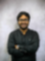 Smiling man with glasses and beard wearing a black shirt