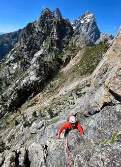 Evan climbing the Durrance Ridge. Ice and Storm Point behind.