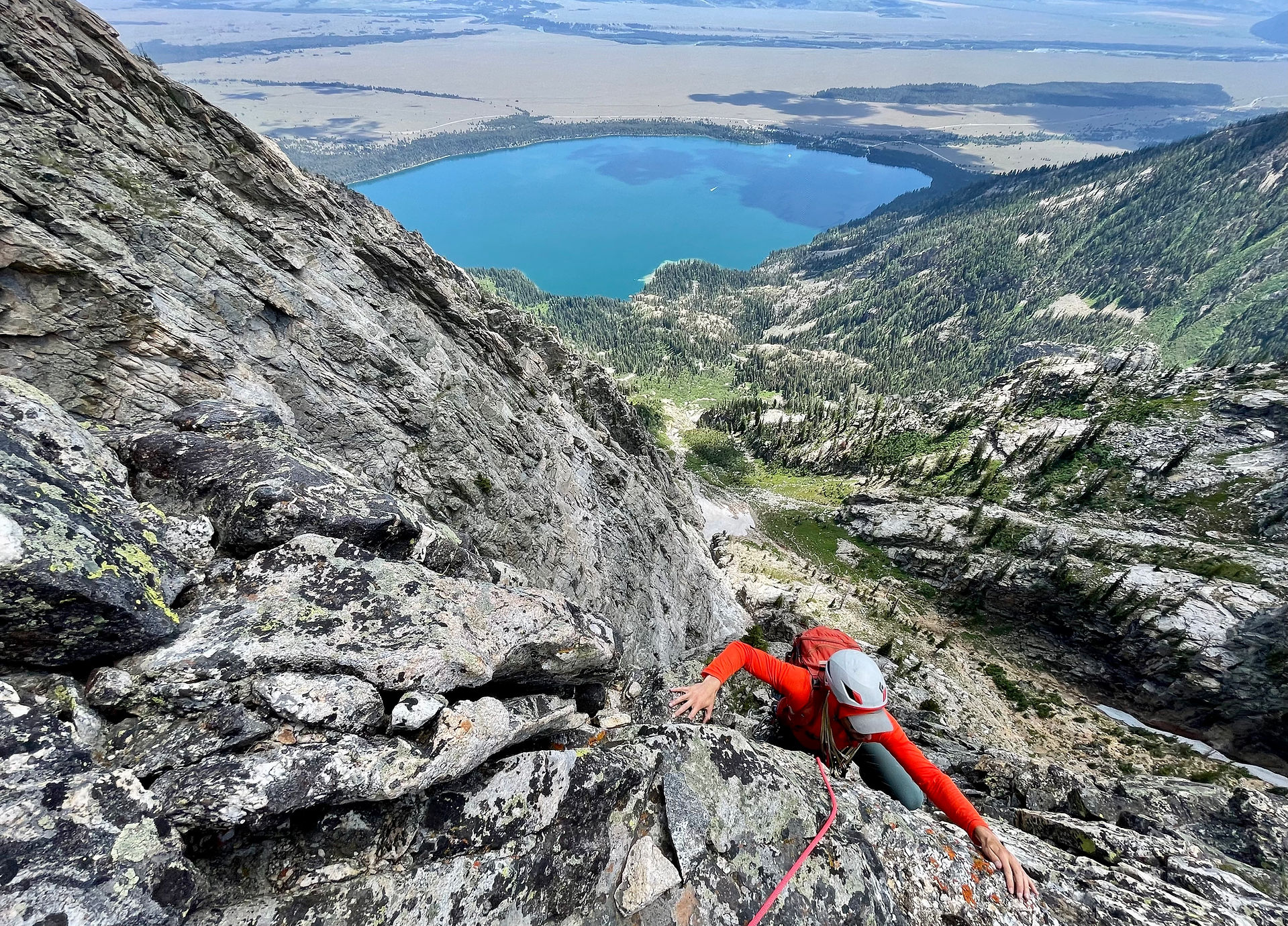 Evan reaching the belay on the third pitch