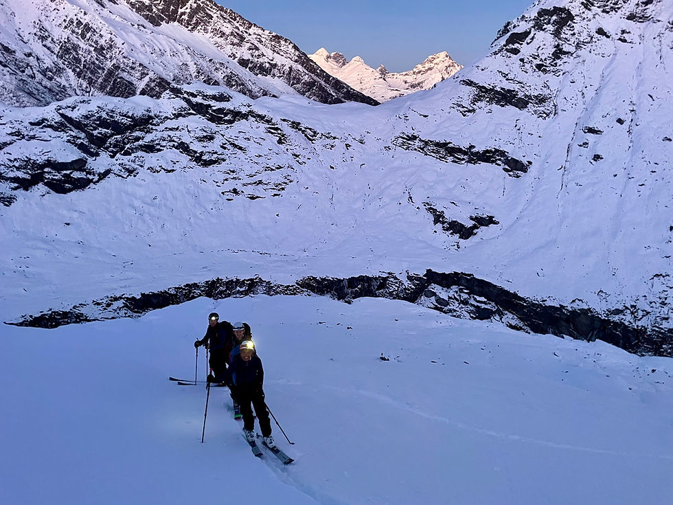 The team skinning up the West Ridge of Headlong Peak. Rees Saddle behind.