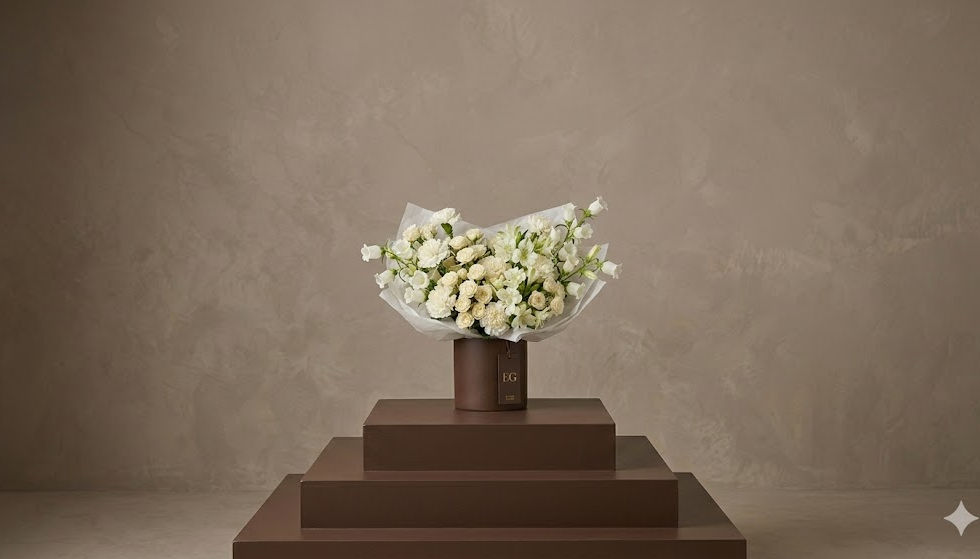 All white floral arrangement for sympathy, comfort, soft celebrations. Wellness flower arrangement. Earth Garden Flower Shop