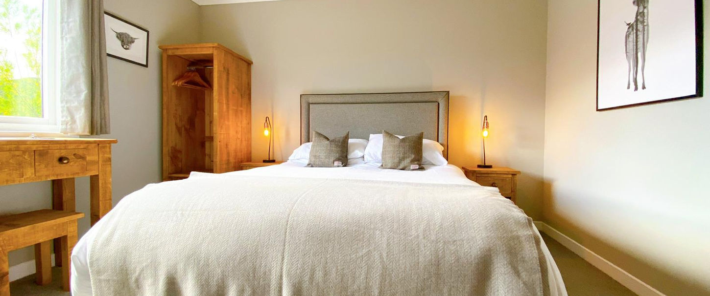 daylit kingsize bed in room of cairngorm guest house aviemore