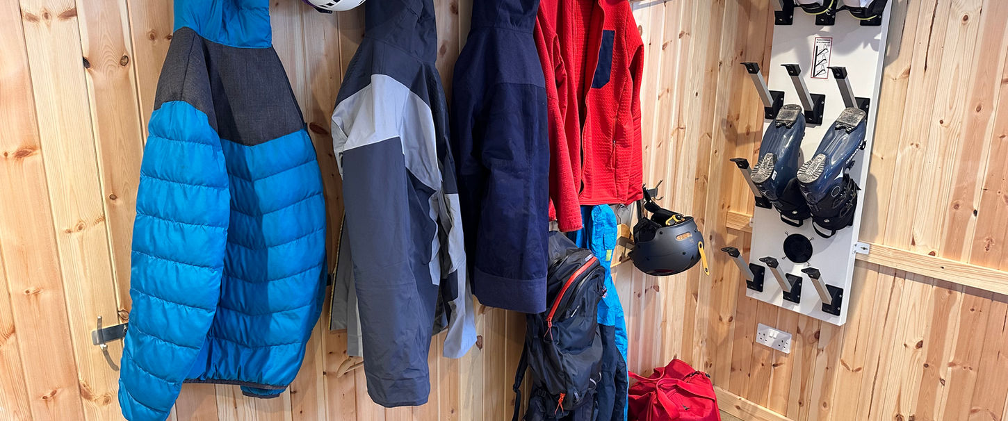 Dedicated gear and drying room at Ravenscraig Guest House with hanging racks and storage for outdoor equipment