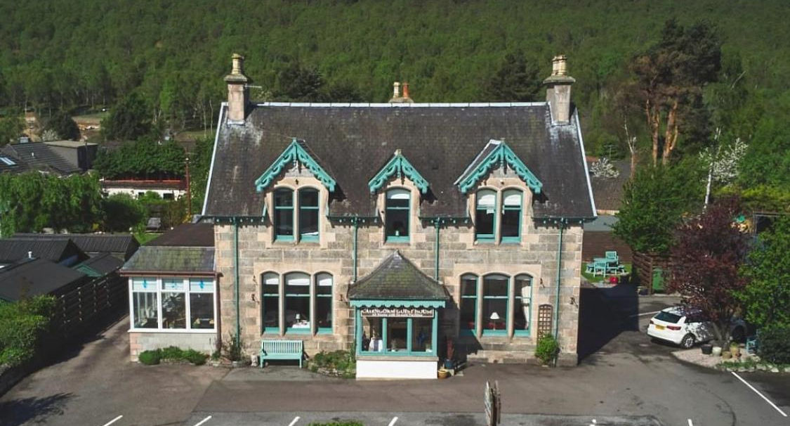 aerial view of cairngorm guest house showing parking spaces