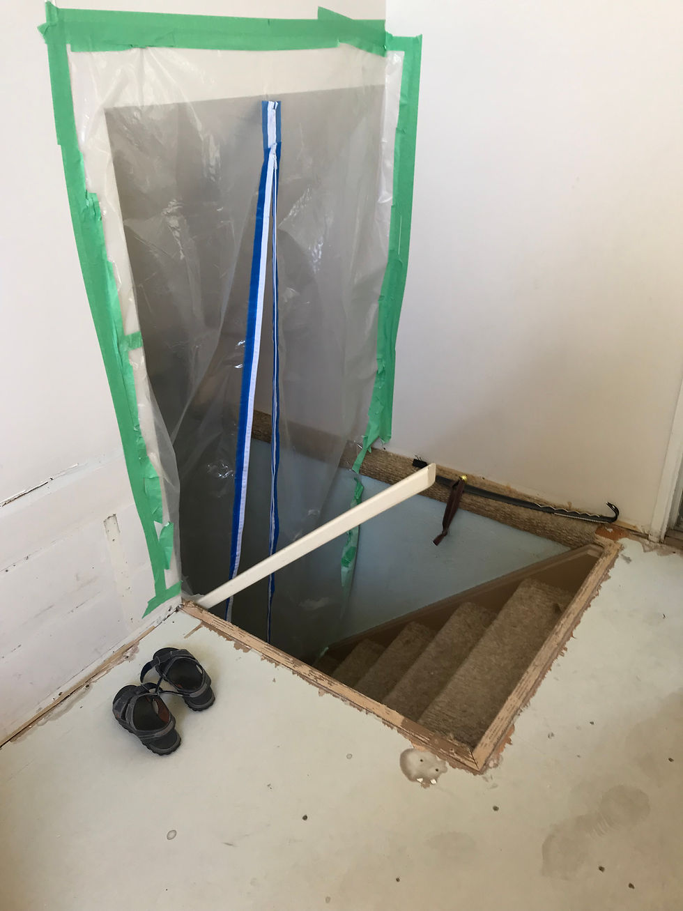 A sealed off stairwell during a main floor renovation