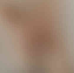 Artistic newborn detail photograph of tiny baby feet held in parents’ hands, captured by Elsiebel Photography, Minneapolis newborn photographer.