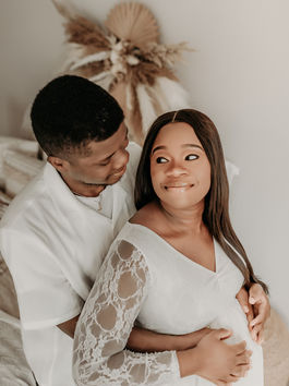 Couple sharing joyful moment during maternity session — natural, emotional photography by Elsiebel Photography Burnsville MN.