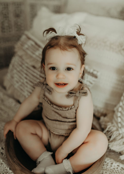 Baby girl sitting during a luxury milestone photography session at Elsiebel Photography serving Burnsville, Minneapolis, Edina, Eden Prairie, Maple Grove, and surrounding areas