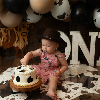 Rustic cake smash photography with country-western theme in Apple Valley