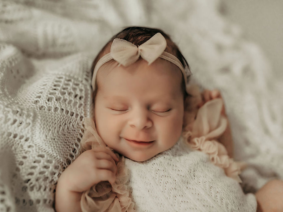 Newborn baby girl portrait in a neutral studio setting by Elsiebel Photography serving Edina, Minnesota